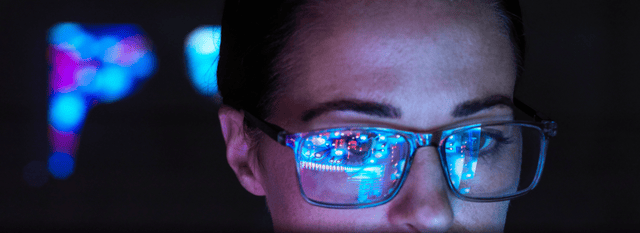 Close-up of a woman's face wearing glasses
